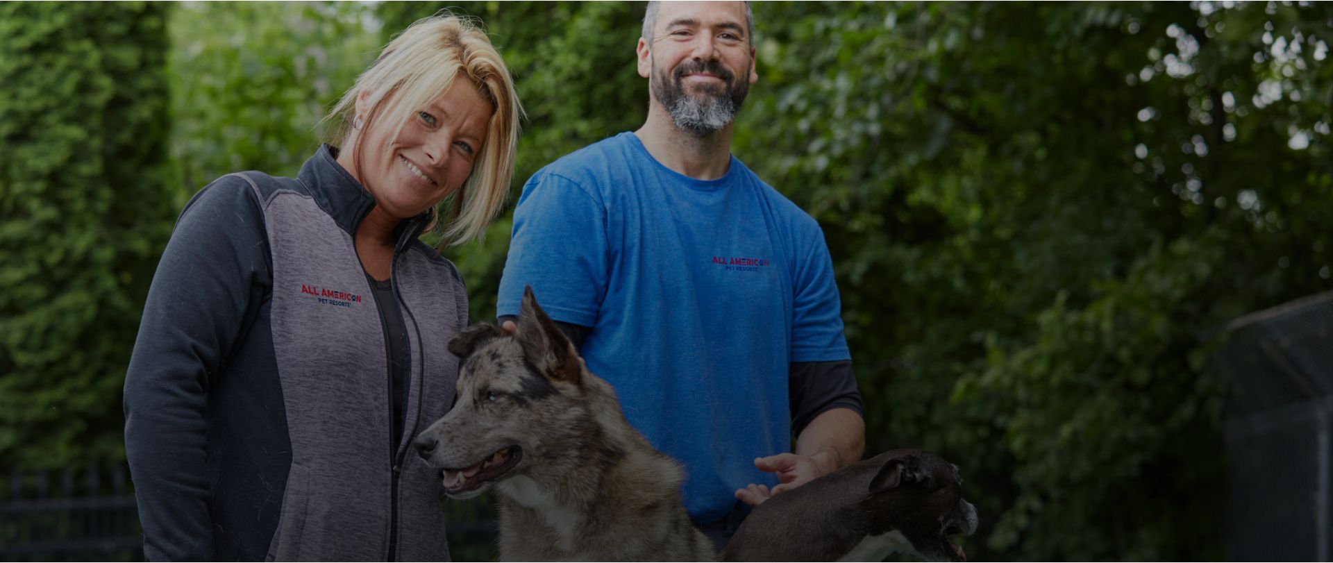 Smiling people with large dog